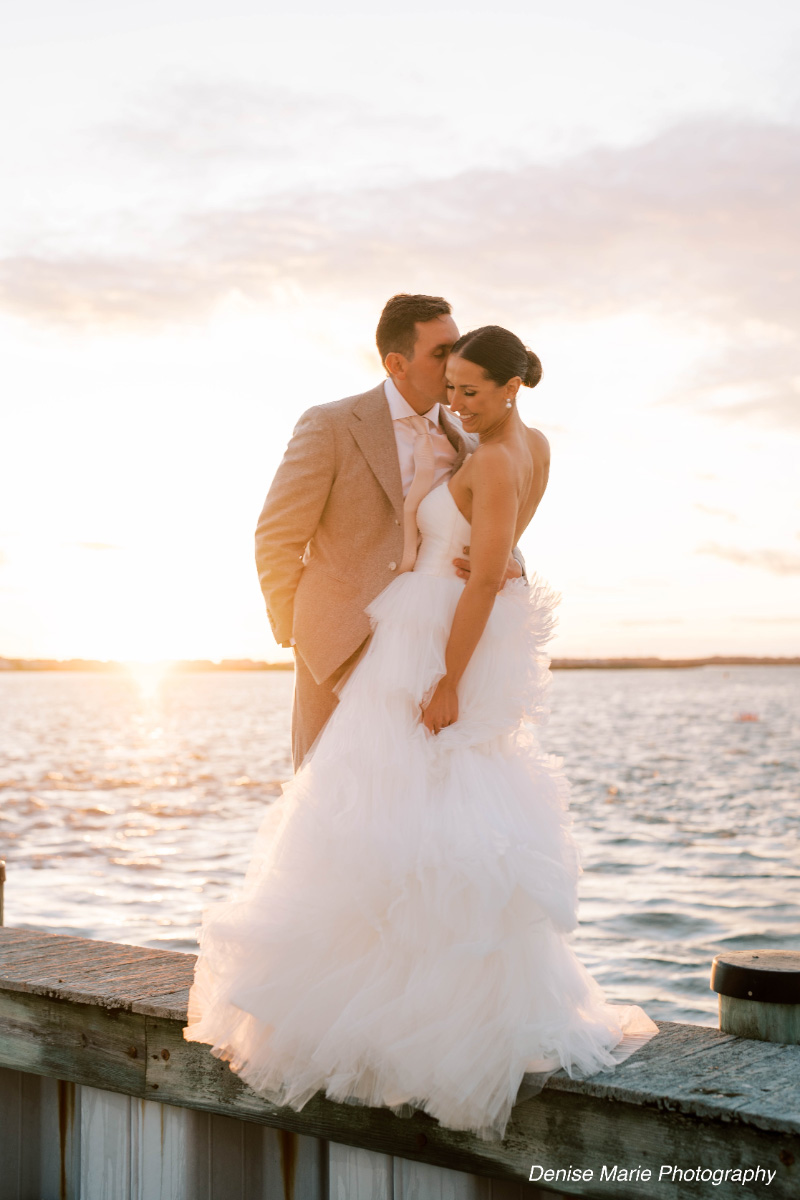 Bride-and-groom-sunset-wedding-kiss-WEDDING-&-EVENTS-Outside-Sunset-Avalon-Yacht-Club